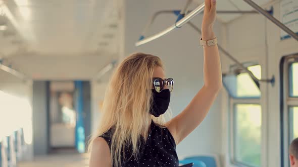 Female In Face Mask On Tram. Woman In Transport Train In Protective Mask Sars COVID19 Virus.