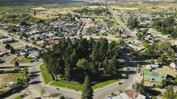 Aerial high angle of a pine tree octagonal square at the center of Trevelin town, Patagonia Argentin