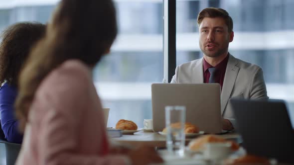 Business Colleagues Talking Cafe Working Online on Laptop Computer in Office