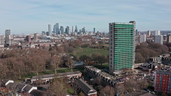 Drone shot towards canary wharf from southwark park London