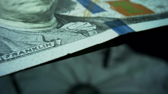 Closeup American Cash Money. One Hundred Dollar Banknote on Black Background