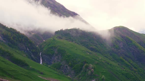 the Green Slope of Caucasus Mountains with Clouds Georgia Kazbegi