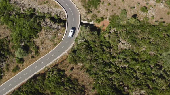 Aerial following a VW-Camper van from above in Bird view on Madeira, Portugal
