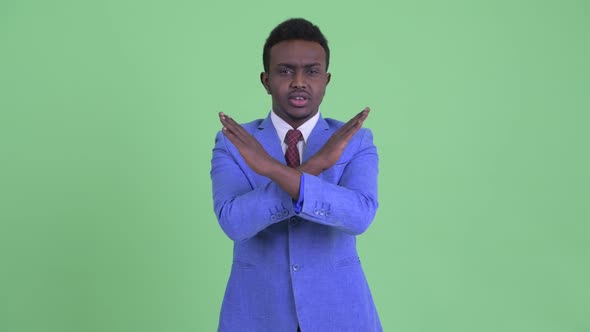 Serious Young African Businessman with Stop Gesture