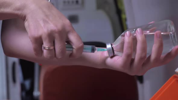 Nurse's Hands Make an Injection in Close Up.