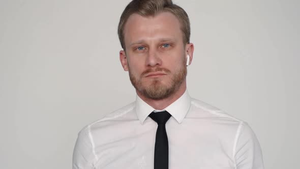 Portrait of Serious Confident Man on White Wall Background Indoors, Successful Office Worker