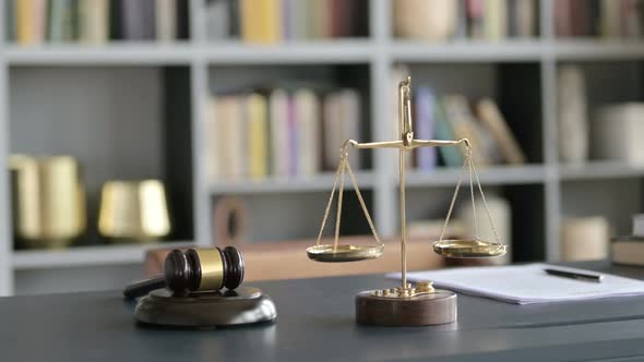 Close Up of Balance Scale and Gravel on Court Room Table