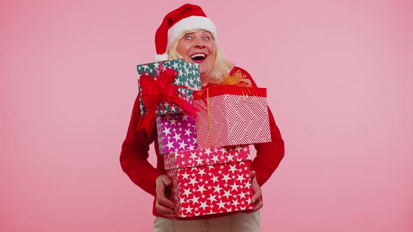 Grandmother Old Woman in Christmas Santa Sweater Holding Many Gift Boxes New Year Presents Shopping