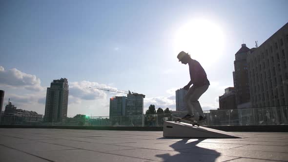 Young Skater Falling Doing Kickflip Trick Outside