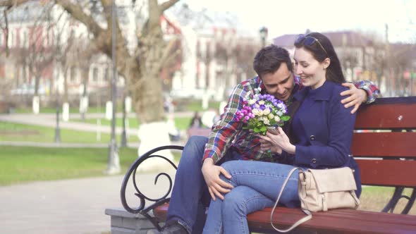 Couple in Love on the Bench in the Park