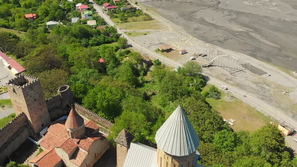 Aerial View Of Ananuri Fortress Complex And Town In K Azbegi