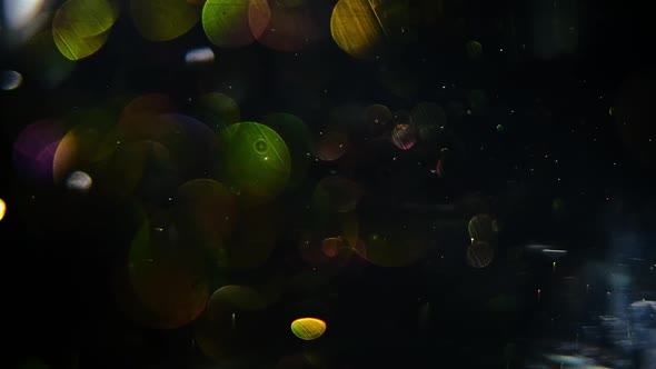 Dust Particles, Random Motion of particles.On Beatiful Relaxing Background. Glittering Particles