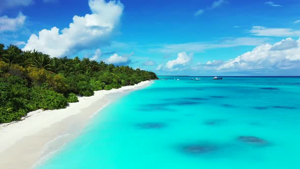 Aerial texture of tranquil coast beach trip by blue water with white sandy background of a dayout ne