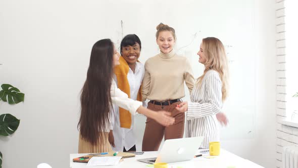 Cheerful Business Team of Four Diverse Women