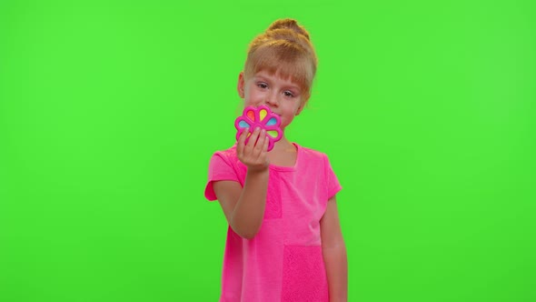 Girl Playing Spinning with Pop It Sensory Antistress Toy in Park Stress Anxiety Relief Chroma Key