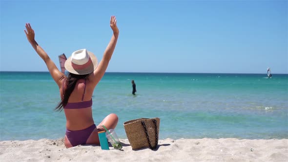 Young Woman in Hat on the Beach Vacation