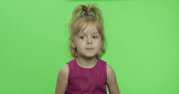 Girl in Purple Dress Tells Something. Happy Four Years Old Child. Chroma Key