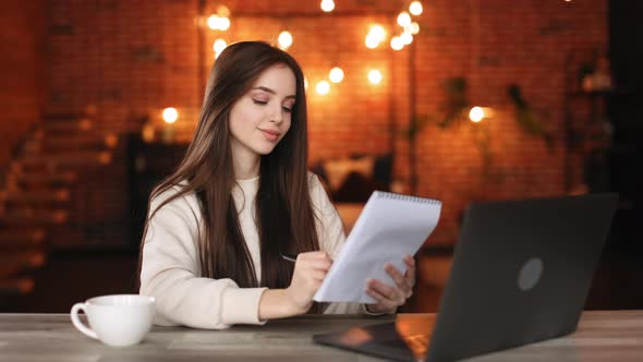 A Woman is Sitting in Her Home Office