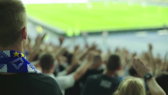 Fans at the Stadium During the Match