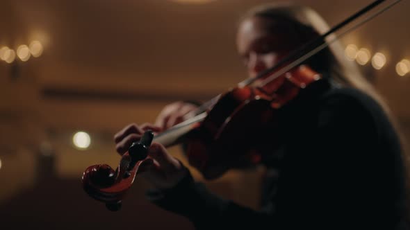 Female Violinist is Playing Violin in Music School Closeup of Fiddle in Hands of Woman