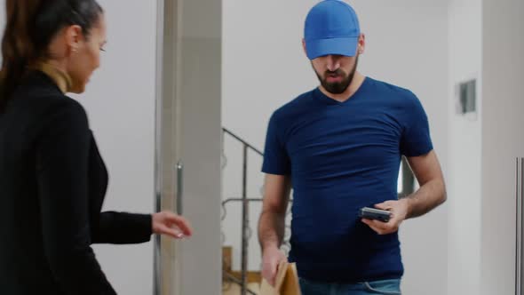 Delivery Guy Bringing Takeaway Food Meal Holding POS Terminal Service in Startup Business Company