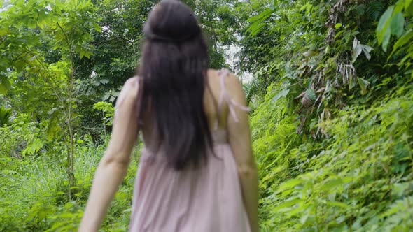 Girl Running On A Forest Path