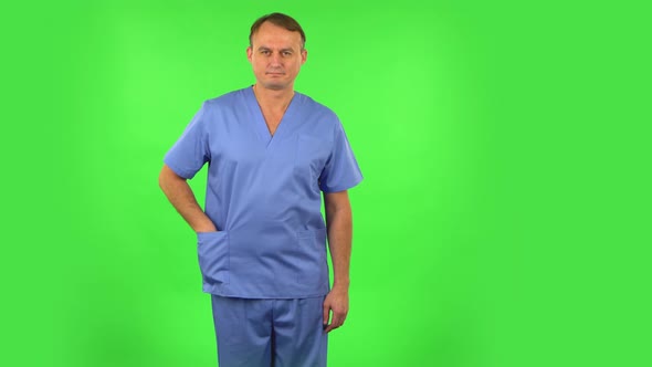 Medical Man Pulls Out a Small Box with a Surprise Making an Offer. Green Screen