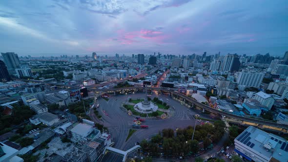 Time lapse of aerial view of Victory Monument on busy street road.