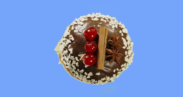  Decorated With Chocolate Glaze, Cherries, Cinnamon And Star Anise.