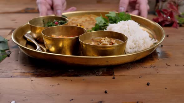 Spicy Chicken Tikka Masala in Bowl on Rustic Wooden Background. With Rice, Indian Naan Butter Bread