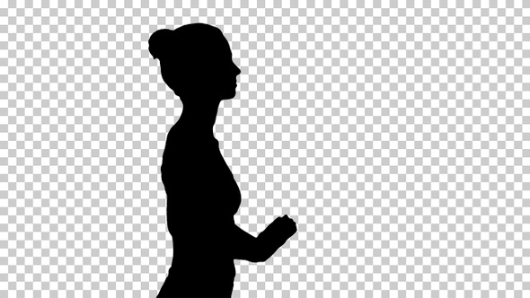 Silhouette Happy sporty woman doing yoga breathing exercise