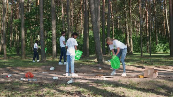 Ecoactivists and Volunteers Clean Up Garbage in the Forest Fight Against Plastic Pollution of Nature