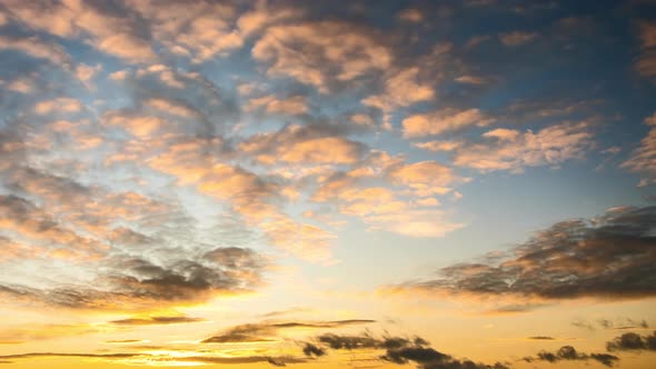 Time Lapse with Fast Moving Clouds on Blue Sky at Sunset