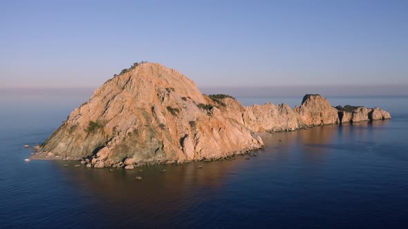 Aerial Panoramic View of Blue Sea with Small Rocky Island