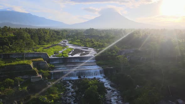 Exotic Javanese landscape cascade waterfall and Mount Merapi Indonesia