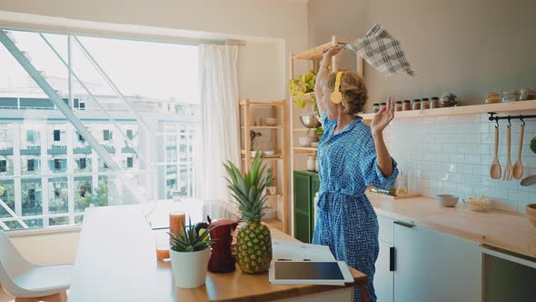 beautiful senior woman spending time in her house