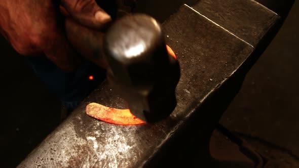 Blacksmith working on a horseshoe