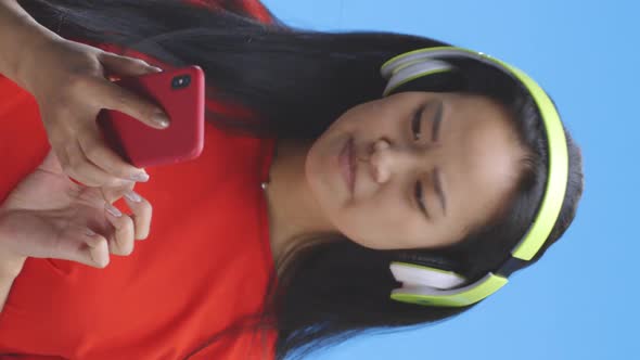 Young Woman Browsing Music