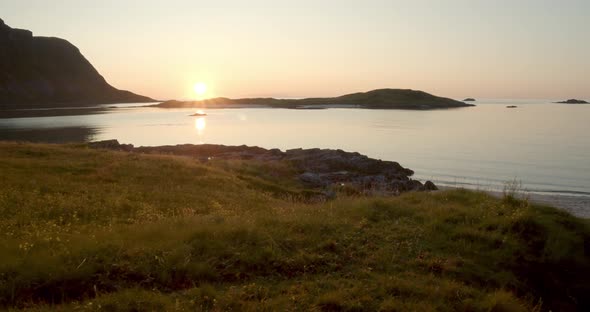 Smooth tracking shot of the sunset on the beach of the Lofoten in Norway