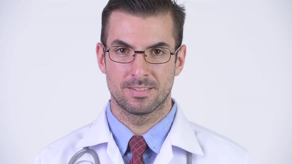 Head Shot of Young Happy Hispanic Man Doctor