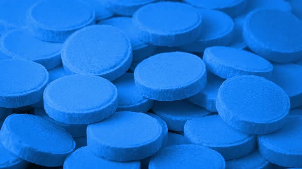 Pile Of Blue Medical Tablets Rotating