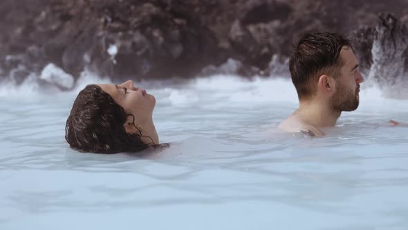 Young Couple Relaxing In Geothermal Spa