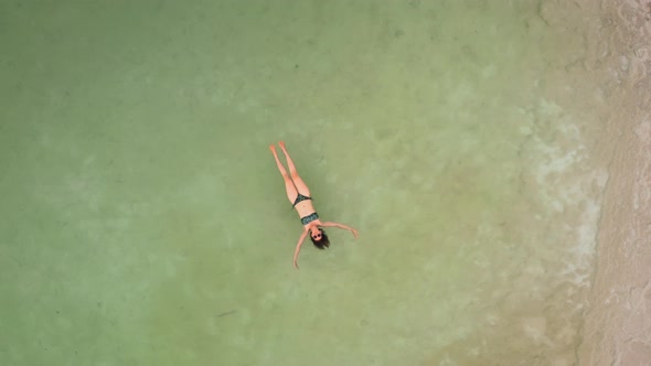 Woman Bathes in the Dead Sea. Aerial Video