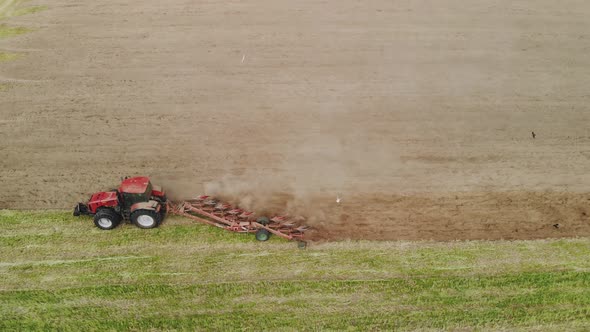 Tractor with Working Plow From a Drone POV