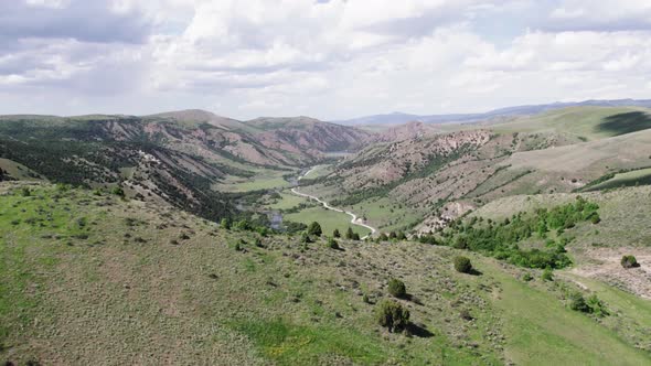 Idaho Green Mountains and Canyons in the Summer with Cloudy Sky Aerial View 4K