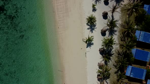 Aerial Top View on Beautiful Green Ocean on Beach with White Sand in Thailand