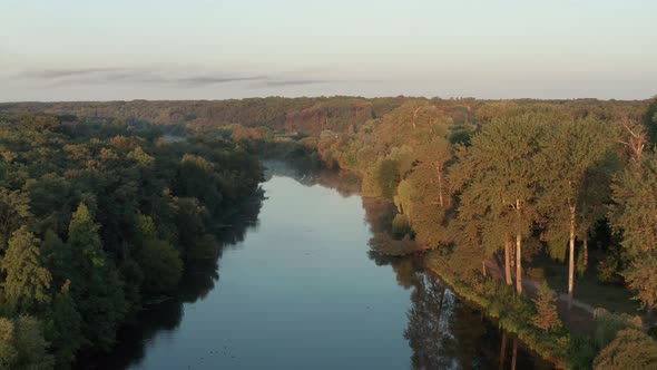 Beautiful morning, summer flight over the river. Fog, trees.