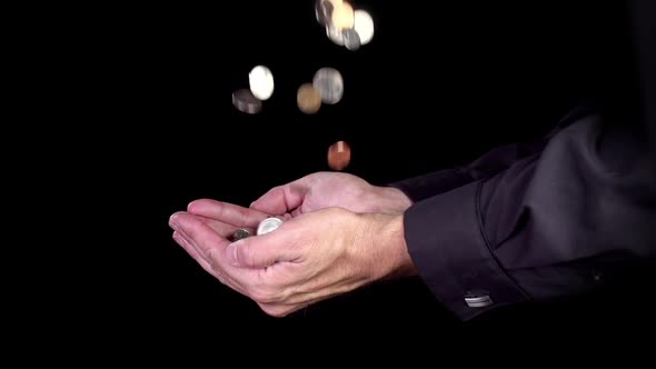 Hands Catching Falling Coins