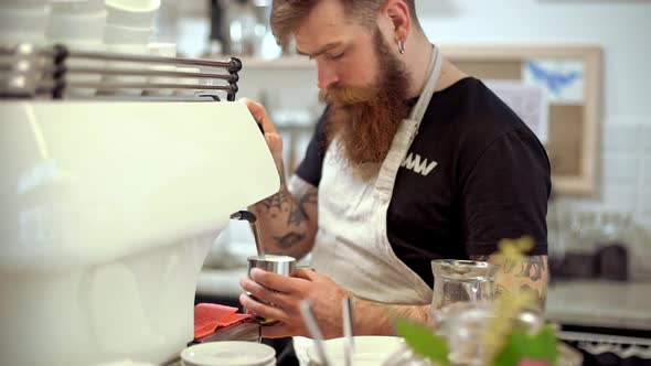 Barista Making Coffee in Coffeeshop