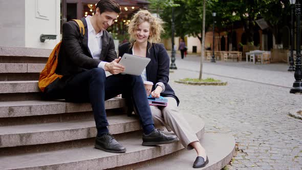 Smiling Large Good Looking Lady and Guy Students